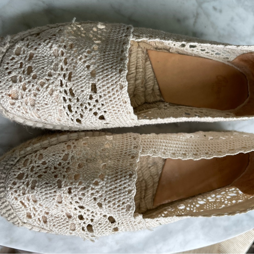 Off-white, lace-like crochet flat espadrilles. Made and purchased in Spain.